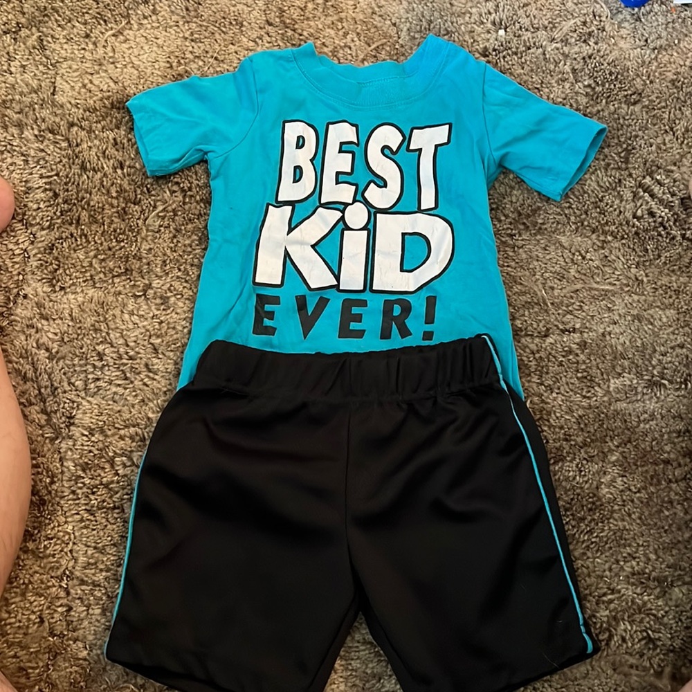 Blue green t-shirt with black shorts combo